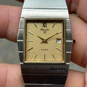 NIVADA QUARTZ WATCH TGP STAINLESS STEEL BACK , case no.0490426 , Grenchen-SWITZERLAND.